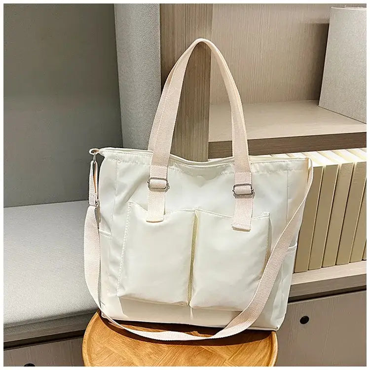Stylish large capacity shopper handbag with dual front pockets and comfortable straps