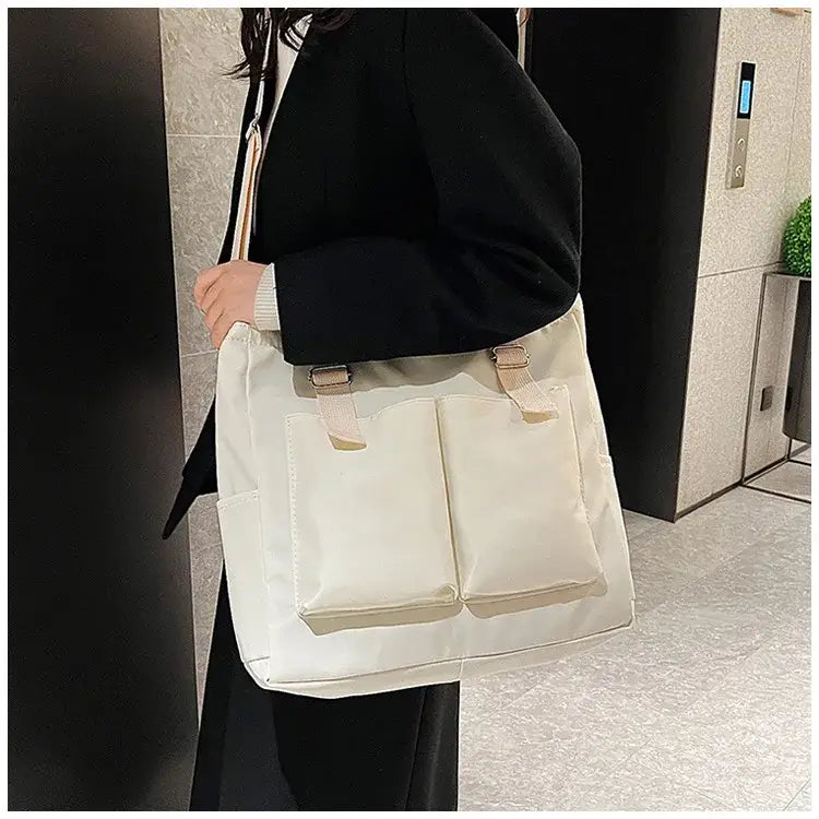 Stylish large capacity shopper handbag in cream color with pockets, perfect for everyday use