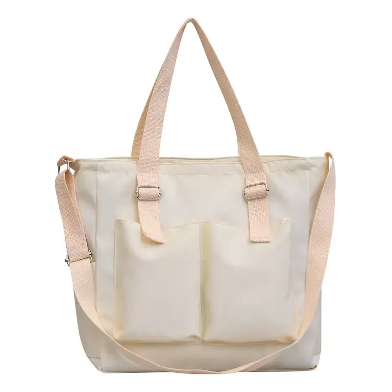 Beige large capacity shopper handbag with dual front pockets and adjustable straps for versatile use