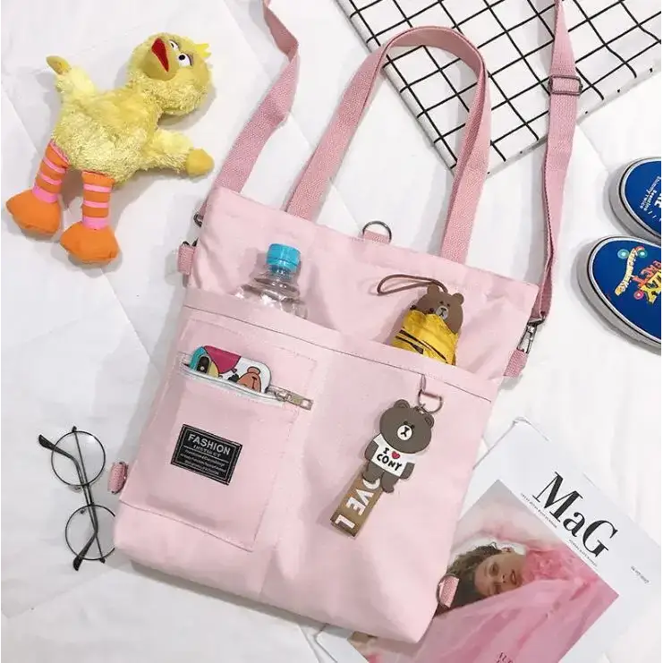 Large capacity tote bag for women in pink with multiple pockets and a trendy design