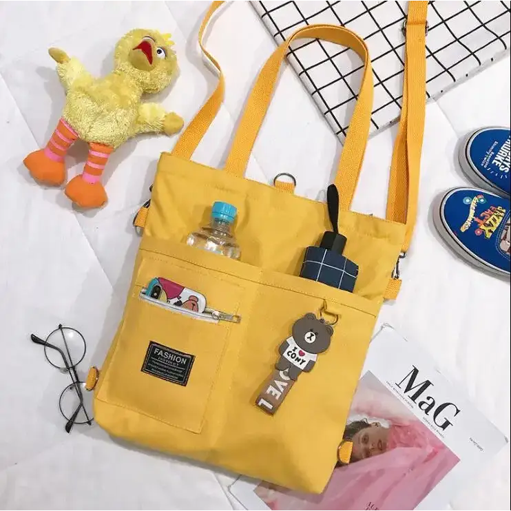 Bright yellow large capacity tote bag for women with multiple pockets and cute accessories