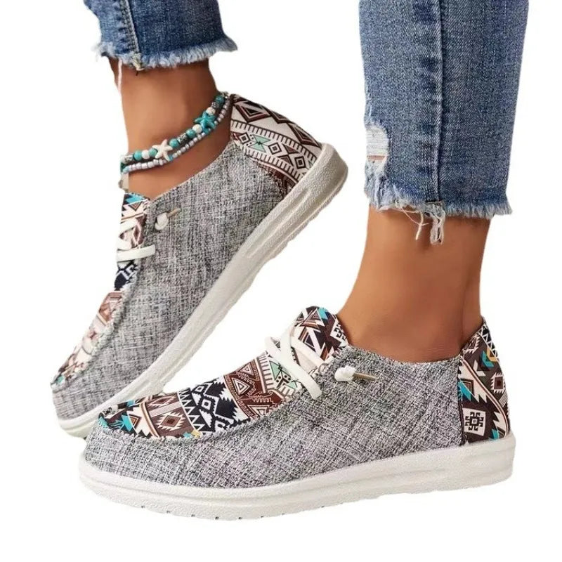 Large size plaid casual shoes with patterned fabric and white soles worn with jeans