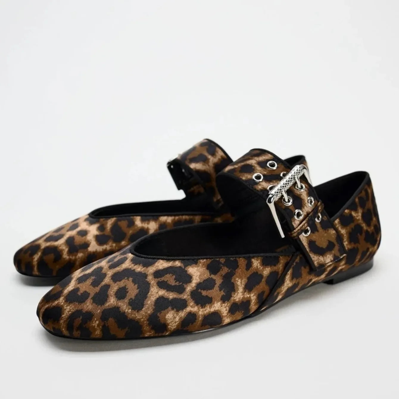 Leopard print pointed toe flats with silver buckle and strap from The Lady's Haven Boutique