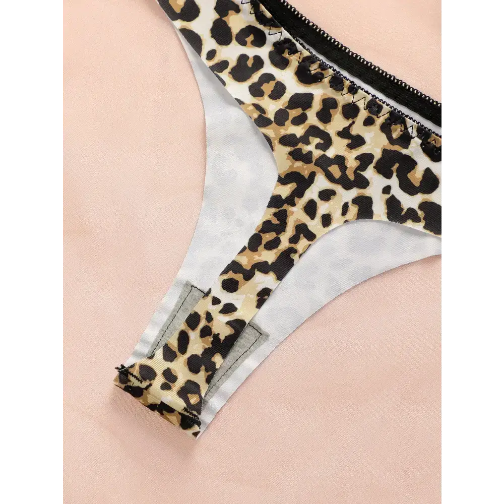 Leopard print thong underwear with black trim from The Lady's Haven Boutique on a pale pink background