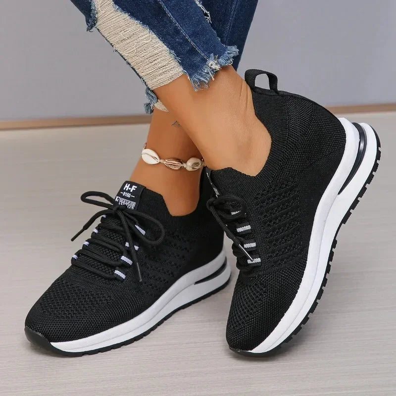 The Lady's Haven Boutique black lightweight walking shoes with knitted upper and white cushioned sole