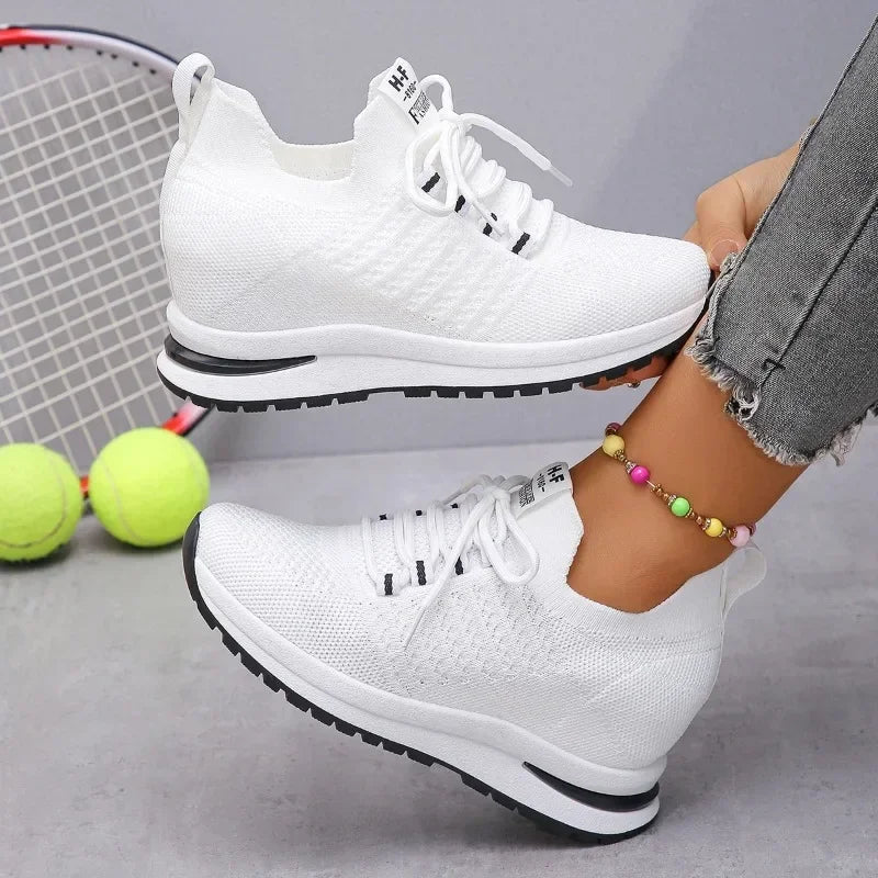 White lightweight walking shoes from The Lady's Haven Boutique worn with casual ankle bracelet and denim jeans