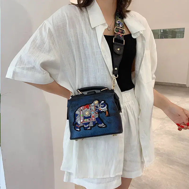 Luxury embroidered crossbody bag with elephant design, perfect for chic casual outfits