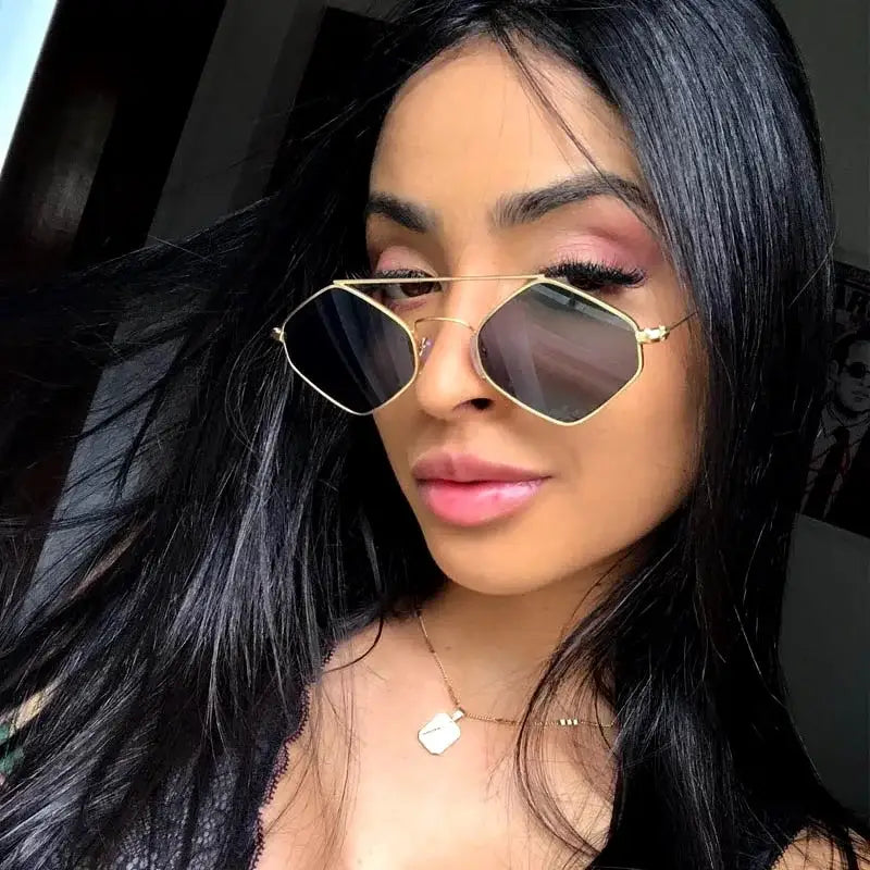 Stylish luxury ladies sunglasses with a metal frame and chic angular design for a fashionable look