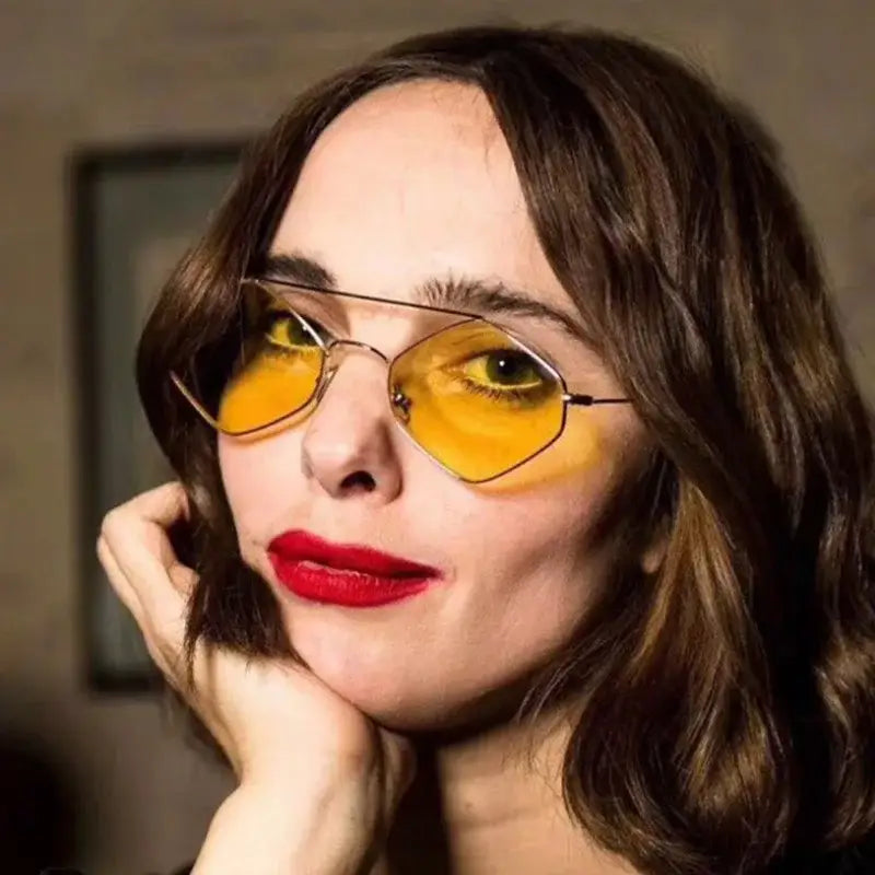 Fashionable luxury ladies sunglasses with metal frame and yellow lenses for stylish outdoor wear