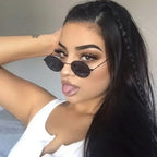 Stylish woman wearing luxury oval sunglasses women with a trendy hairstyle and makeup