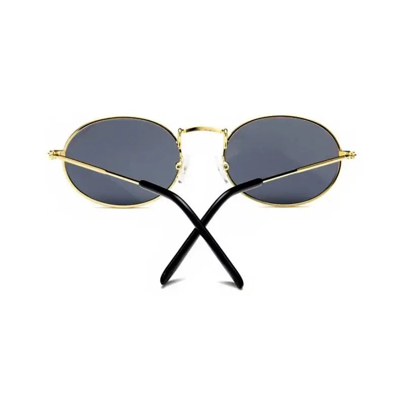 Luxury oval sunglasses women with gold frame and black temple arms for stylish sun protection
