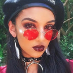 Fashionable luxury oval sunglasses women with red lenses for stylish summer outfits