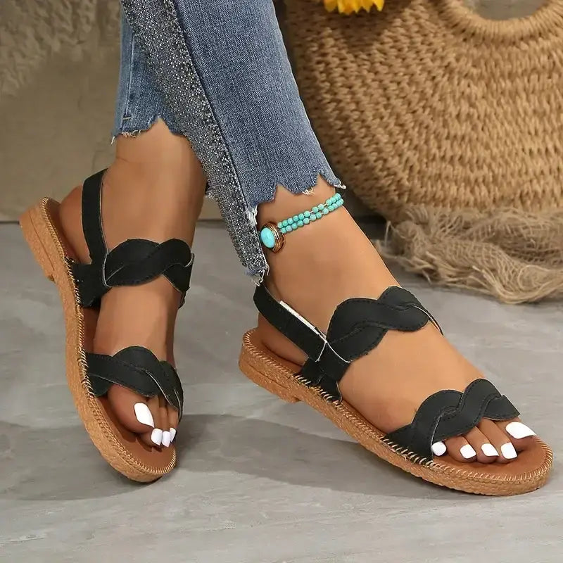Black non slip flat heel summer sandals from The Lady's Haven Boutique with braided straps and tan sole