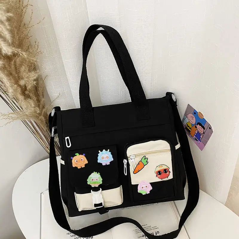 Stylish nylon crossbody messenger bag with cute character patches and adjustable strap