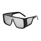 Chic black oversize fashion sunglasses with a bold geometric design and UV protection