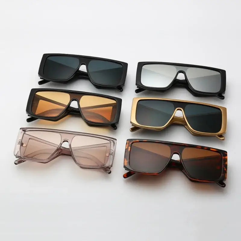 Assorted oversize fashion sunglasses in black, gold, tortoise, and various shades