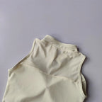 Beige padded gym crop top with a stylish design for comfortable workouts