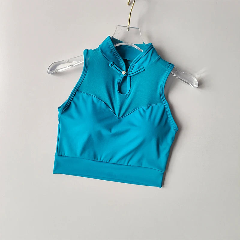 Teal sleeveless padded gym crop top with a high neck and front keyhole detail
