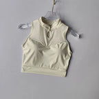 Beige padded gym crop top featuring a stylish high neckline and keyhole detail for a trendy workout look