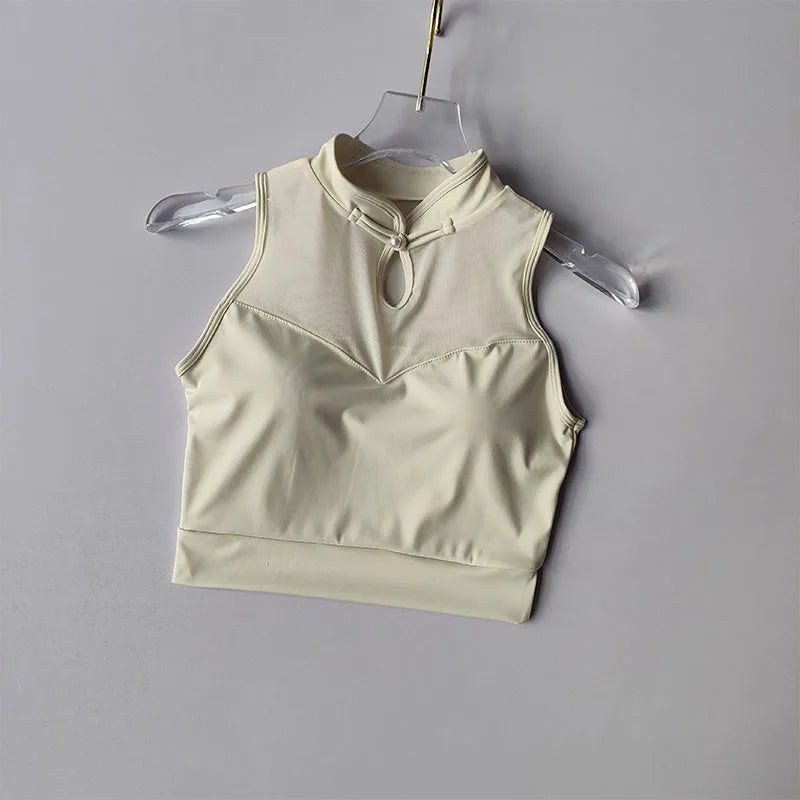Beige padded gym crop top featuring a stylish high neckline and keyhole detail for a trendy workout look