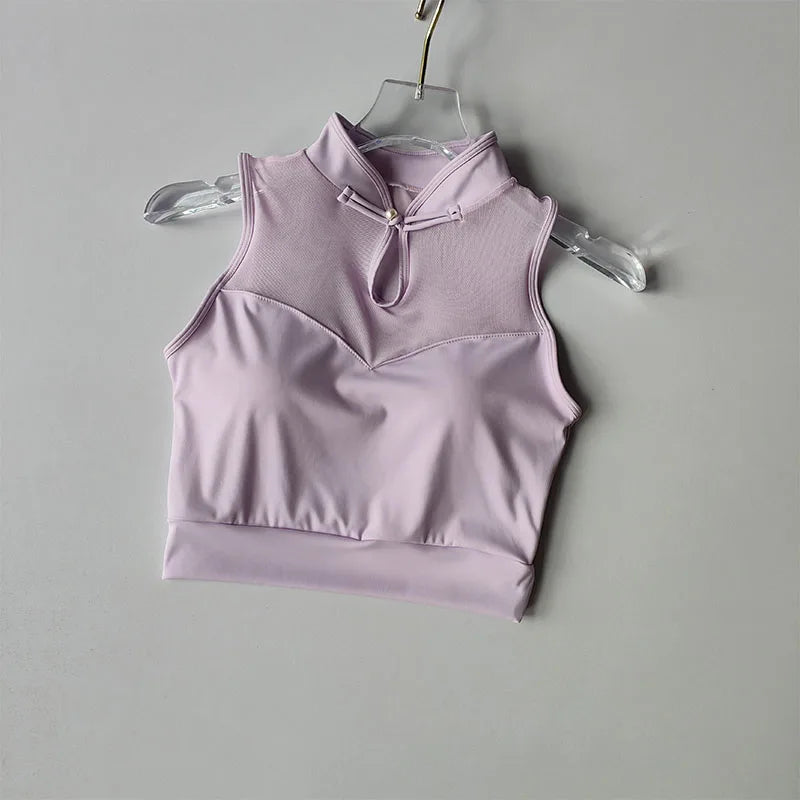 Light purple padded gym crop top with high neck and mesh panel for stylish comfort