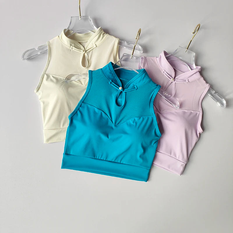 Three colorful padded gym crop tops in blue, light yellow, and lavender from The Lady's Haven Boutique