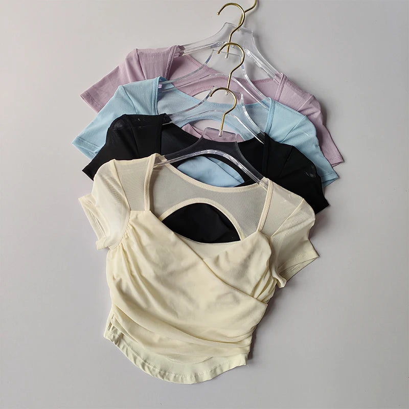 Collection of padded yoga shirts for women in various colors including black, blue, lavender, and cream
