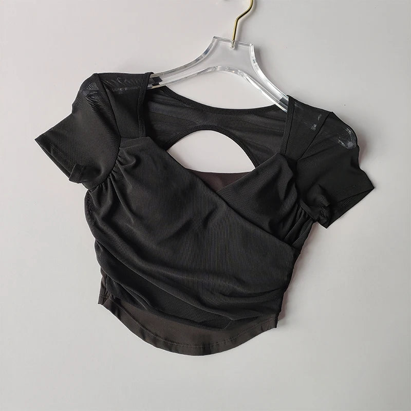 Elegant black padded yoga shirts for women featuring a stylish open back design