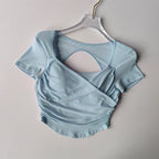 Light blue padded yoga shirt for women with stylish back design and comfortable fit