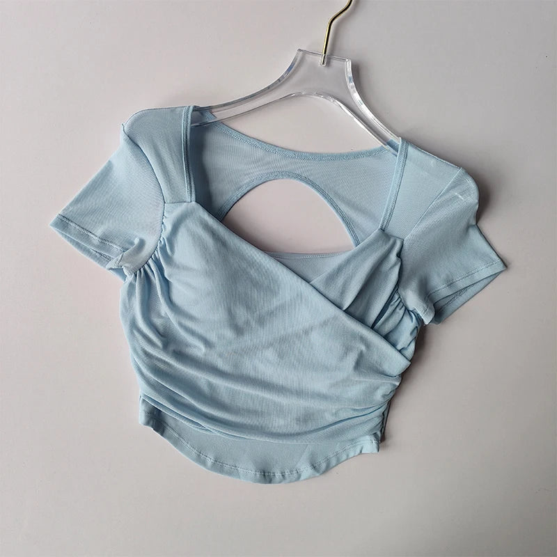 Light blue padded yoga shirt for women with stylish back design and comfortable fit