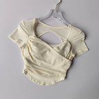 Cream Padded Yoga Shirts for Women with Stylish Open Back Design for Comfort and Flexibility