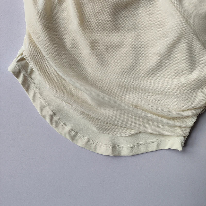 Cream colored padded yoga shirts for women with soft fabric and comfortable fit