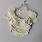 Cream Padded Yoga Shirts for Women with Cut-Out Back Detail for Stylish Comfort