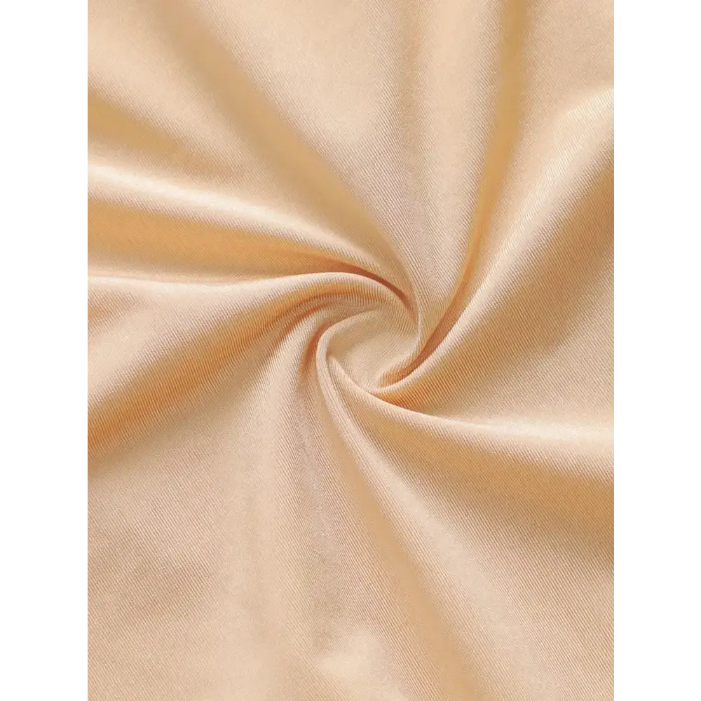 Soft beige fabric close-up for plus size lace underwear for women showing smooth texture