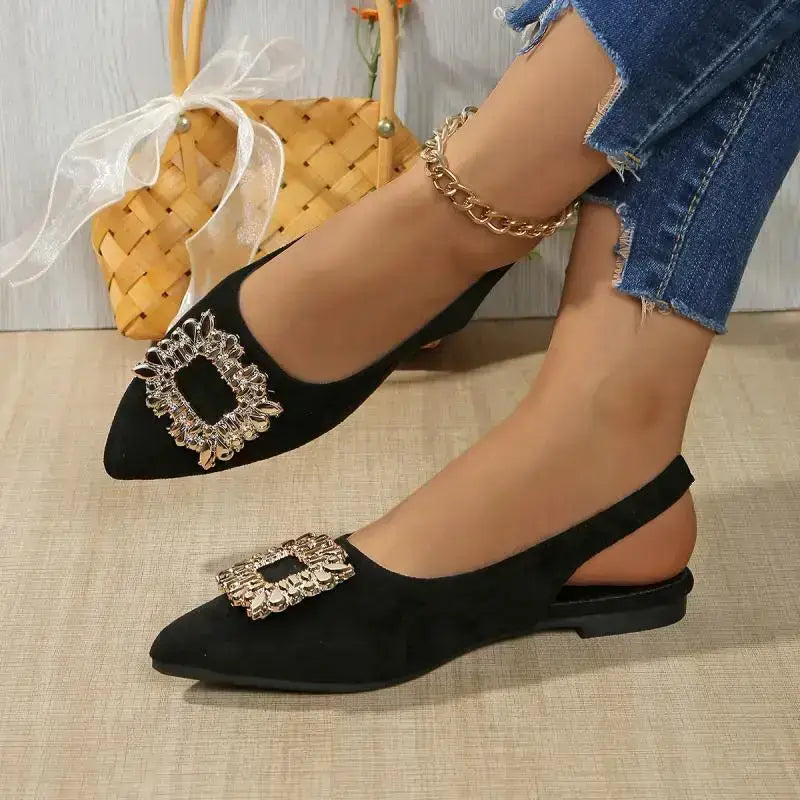 Black pointed toe crystal buckle sandals flat heel from The Lady's Haven Boutique worn with ripped jeans