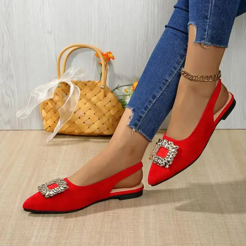 The Lady's Haven Boutique red flat heel pointed toe crystal buckle sandals on model