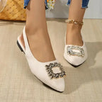 The Lady's Haven Boutique pointed toe crystal buckle sandals flat heel sandals in white on model