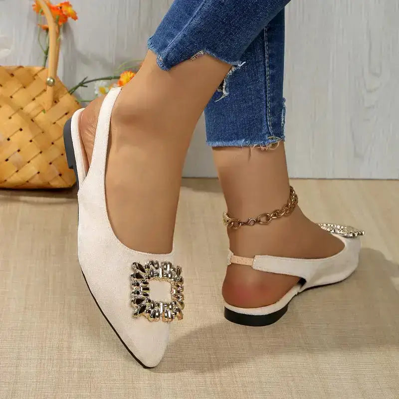 The Lady's Haven Boutique pointed toe crystal buckle sandals flat heel in beige worn with jeans