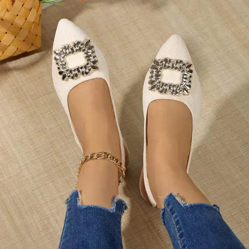 The Lady's Haven Boutique white pointed toe crystal buckle sandals with flat heels worn with blue jeans