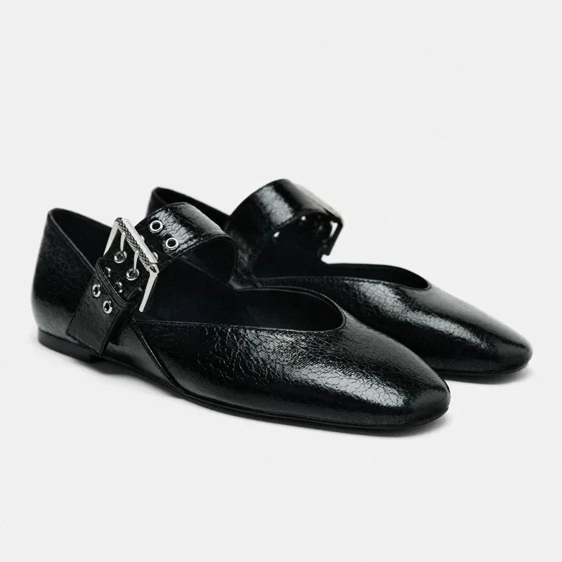 Black leather pointed toe flats with adjustable buckle strap from The Lady's Haven Boutique