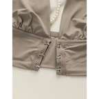Close-up of beige push up bralette no underwire with hook-and-eye closure and gathered fabric detail