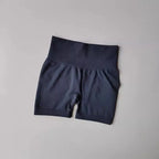 High-waist push-up gym shorts for women in dark color, perfect for workouts and training