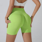 Bright green push-up gym shorts for women with a high waist design for comfort and support