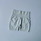 Light gray push-up gym shorts for women with a high waistband for enhanced comfort