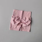 Pink push-up gym shorts for women with a high waistband and scrunch design for a flattering fit