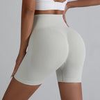 Light gray push-up gym shorts for women designed for comfort and style during workouts