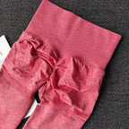 Stretchy pink push up leggings for women featuring a high waist and ruching detail