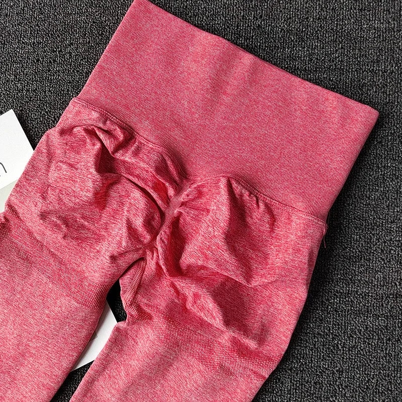 Stretchy pink push up leggings for women featuring a high waist and ruching detail