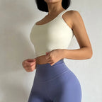 Light beige push up sports bras for women with adjustable straps and stretchy fabric