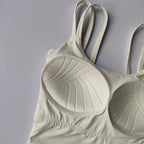 Beige push up sports bras for women with stylish ribbed design and adjustable straps